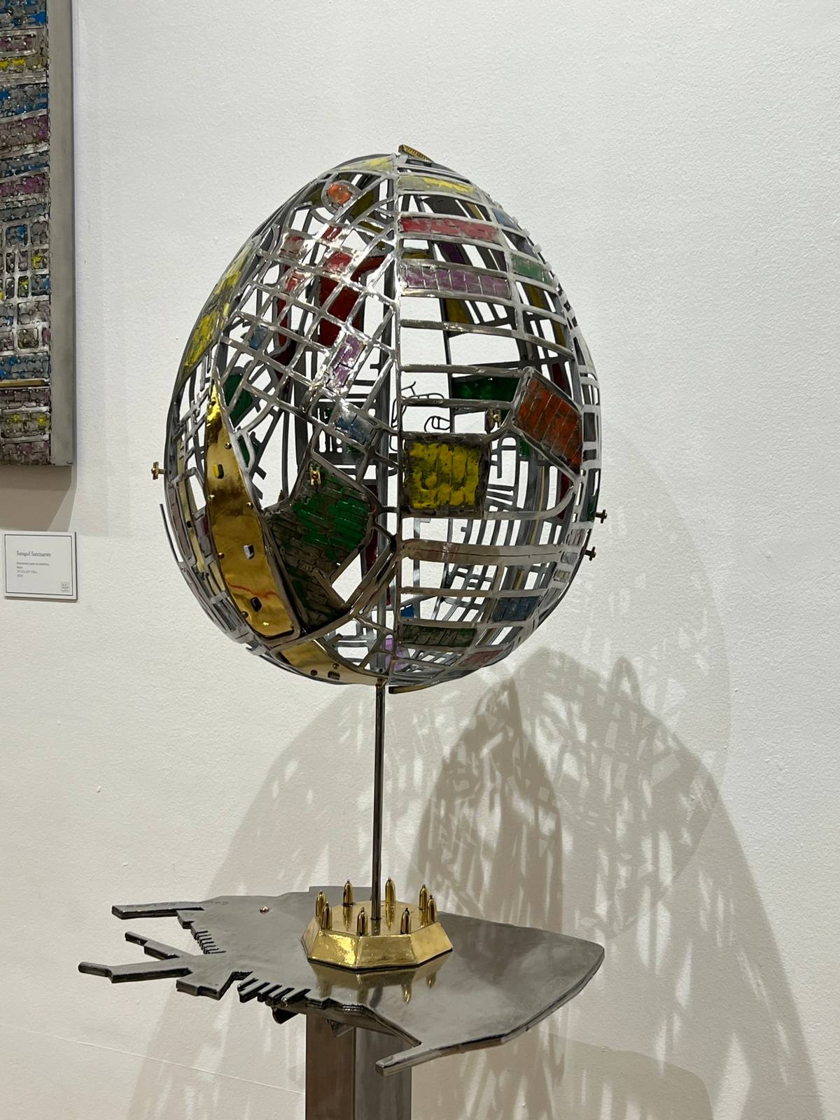 ‘Nest of Healing,’  automotive paint on stainless, brass 15 x 28 1/2 x19 inches 2024.