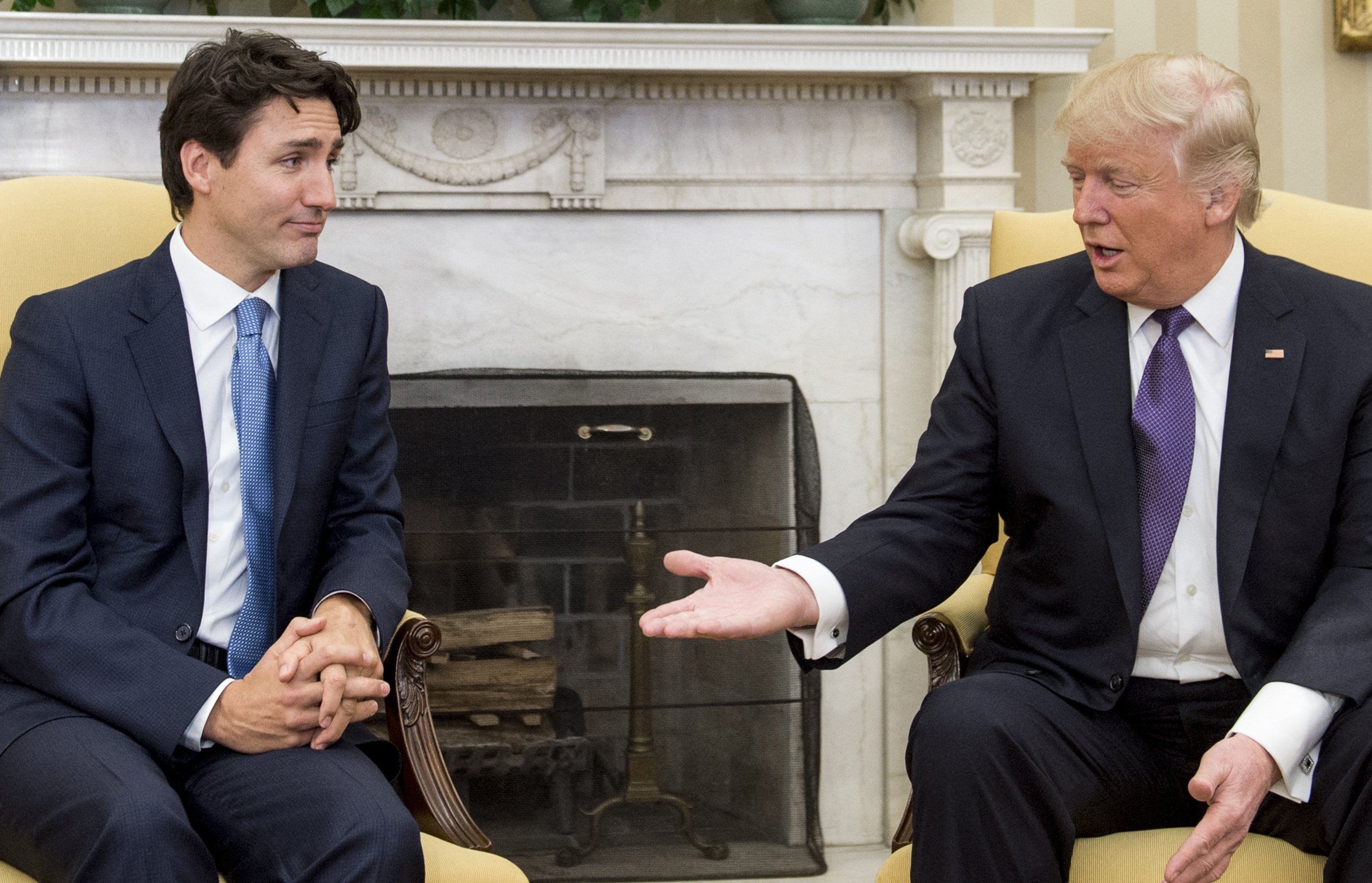 US President Donald Trump and Canadian Prime Minister Justin Trudeau meet in the Oval Office of the White House in Washington, DC, on February 13, 2017. US President Donald Trump, after a call with Prime Minister Justin Trudeau, accused the Canadian leader on March 5, 2025, of playing up a Canada-US trade war to cling to power. Trump said in a social media post that Trudeau "was unable to tell me when the Canadian Election is taking place, which made me curious, like, what's going on here? I then realized he is trying to use this issue to stay in power."