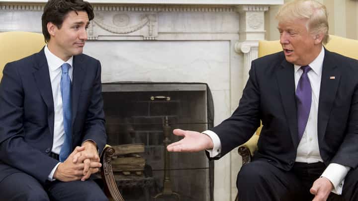 US President Donald Trump and Canadian Prime Minister Justin Trudeau meet in the Oval Office of the White House in Washington, DC, on February 13, 2017. US President Donald Trump, after a call with Prime Minister Justin Trudeau, accused the Canadian leader on March 5, 2025, of playing up a Canada-US trade war to cling to power. Trump said in a social media post that Trudeau "was unable to tell me when the Canadian Election is taking place, which made me curious, like, what's going on here? I then realized he is trying to use this issue to stay in power."