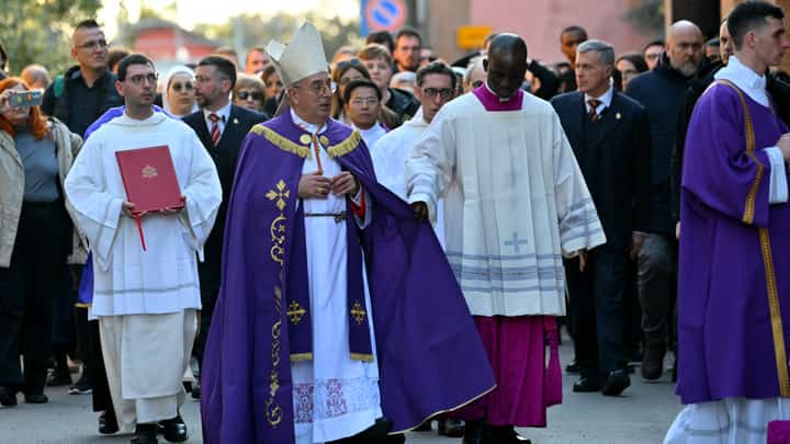 Italian cardinal Angelo De Donatis (C) arrives with a procession at the Church of Saint Sabina in Rome during the celebration of Ash Wednesday mass on 5 March 2025. Pope Francis's condition was stable on 5 March 2025 as he neared three weeks in hospital battling pneumonia, a Vatican source said, with celebrations for the Lent religious season starting without him.