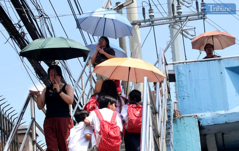 Umbrellas up amid extreme heat