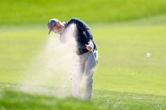 Late birdies lift Clark to top of leaderboard
