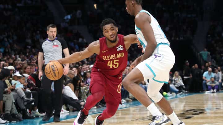 Donovan Mitchell leads the way as the Cleveland Cavaliers rally past the Charlotte Hornets, 118-117, in their NBA regular season game.