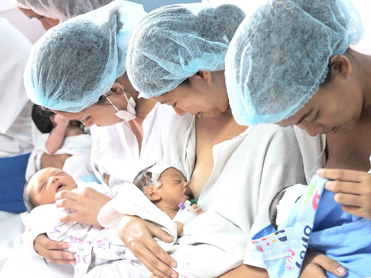 Mothers breastfeed their newborn babies at the Fabella Hospital in Manila.