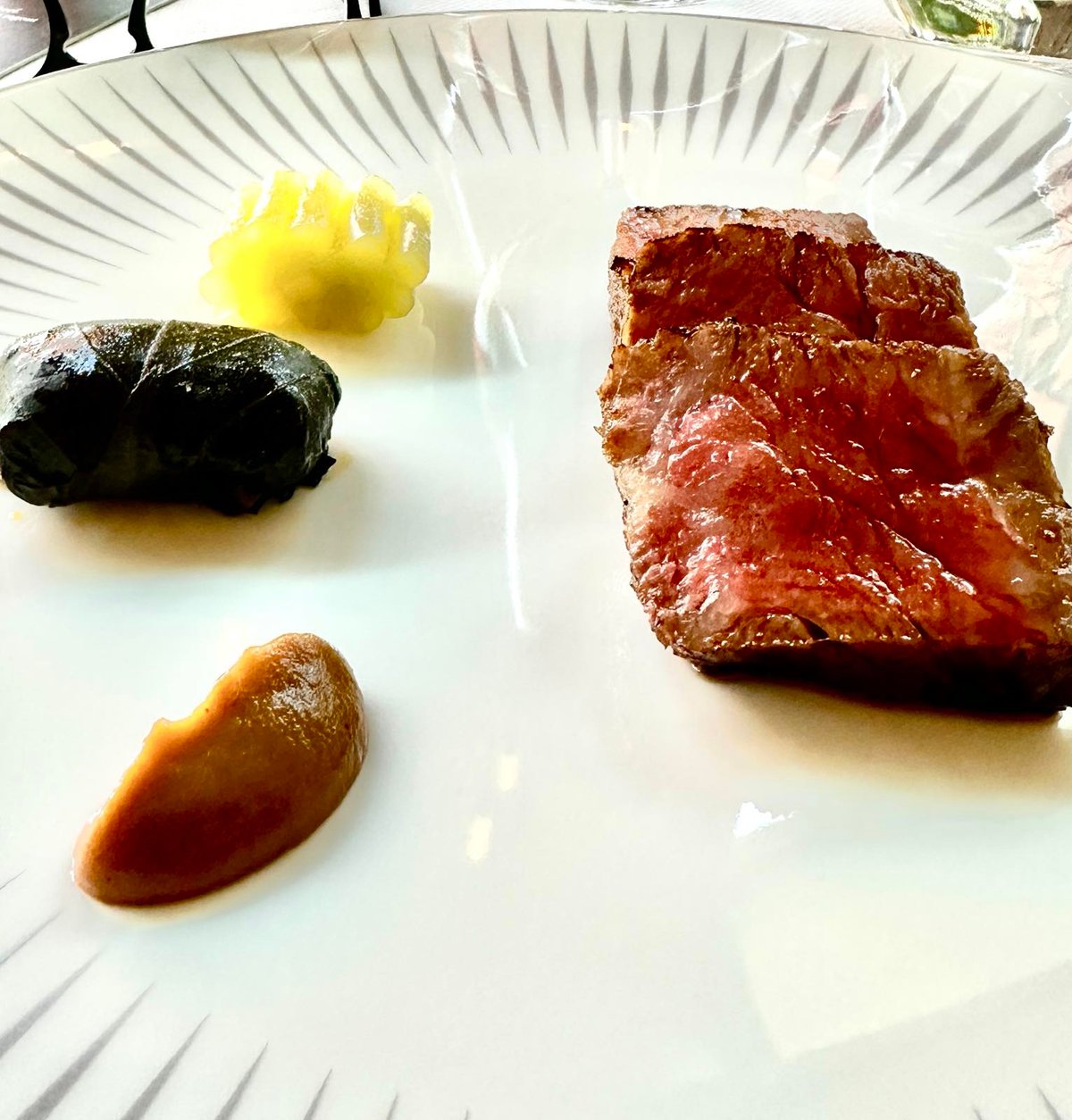 Melt-in-your-mouth Miyazaki grilled wagyu beef with celtuce (a cultivar of lettuce), onion puree, and mushroom ragout, washed down by Heritage: ‘An 462,’ 2022 Gerard Bertrand, Languedoc, France.
