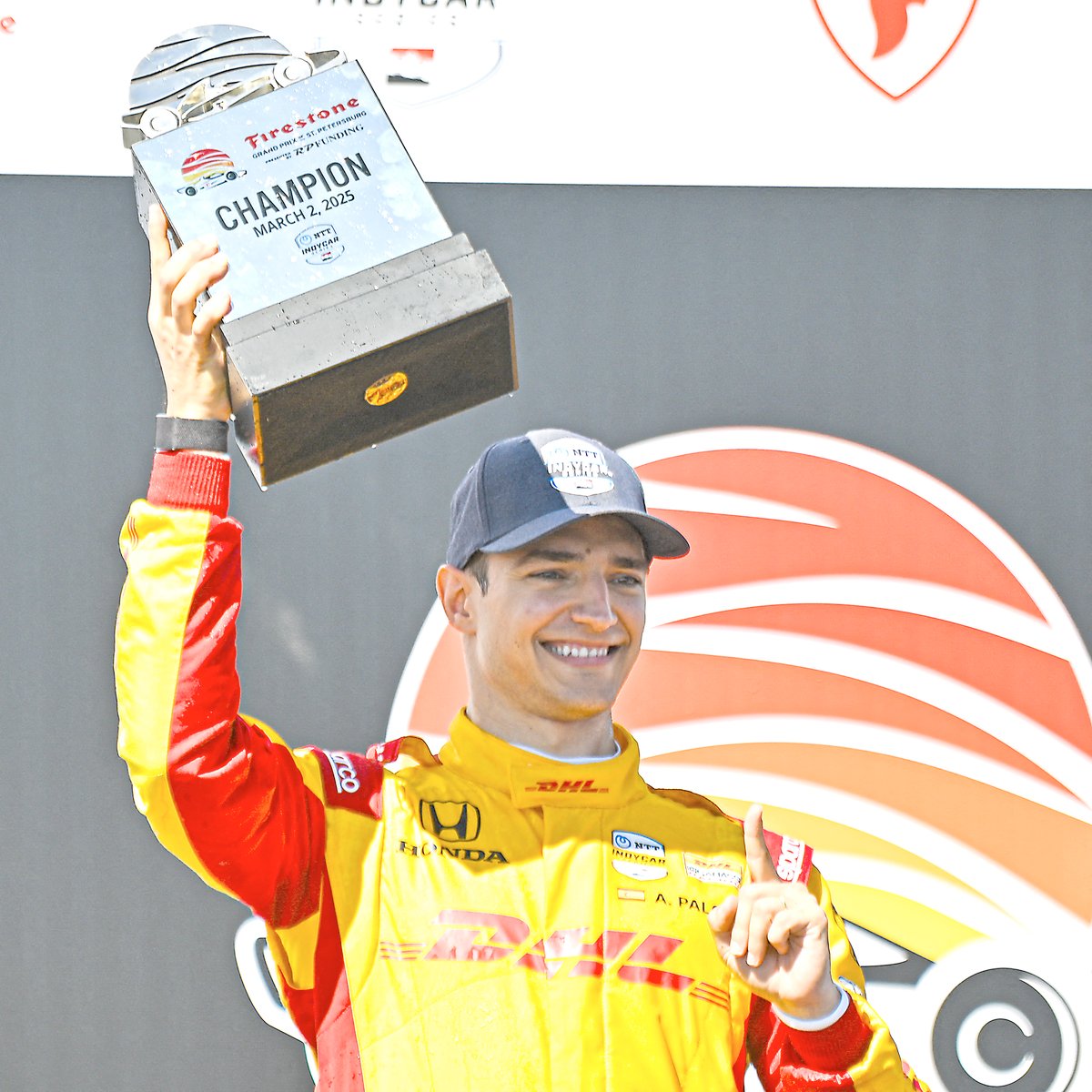 Driver of the #10 DHL Team Ganassi Honda, Alex Palou, celebrates with the trophy after winning the NTT INDYCAR Firestone Grand Prix.