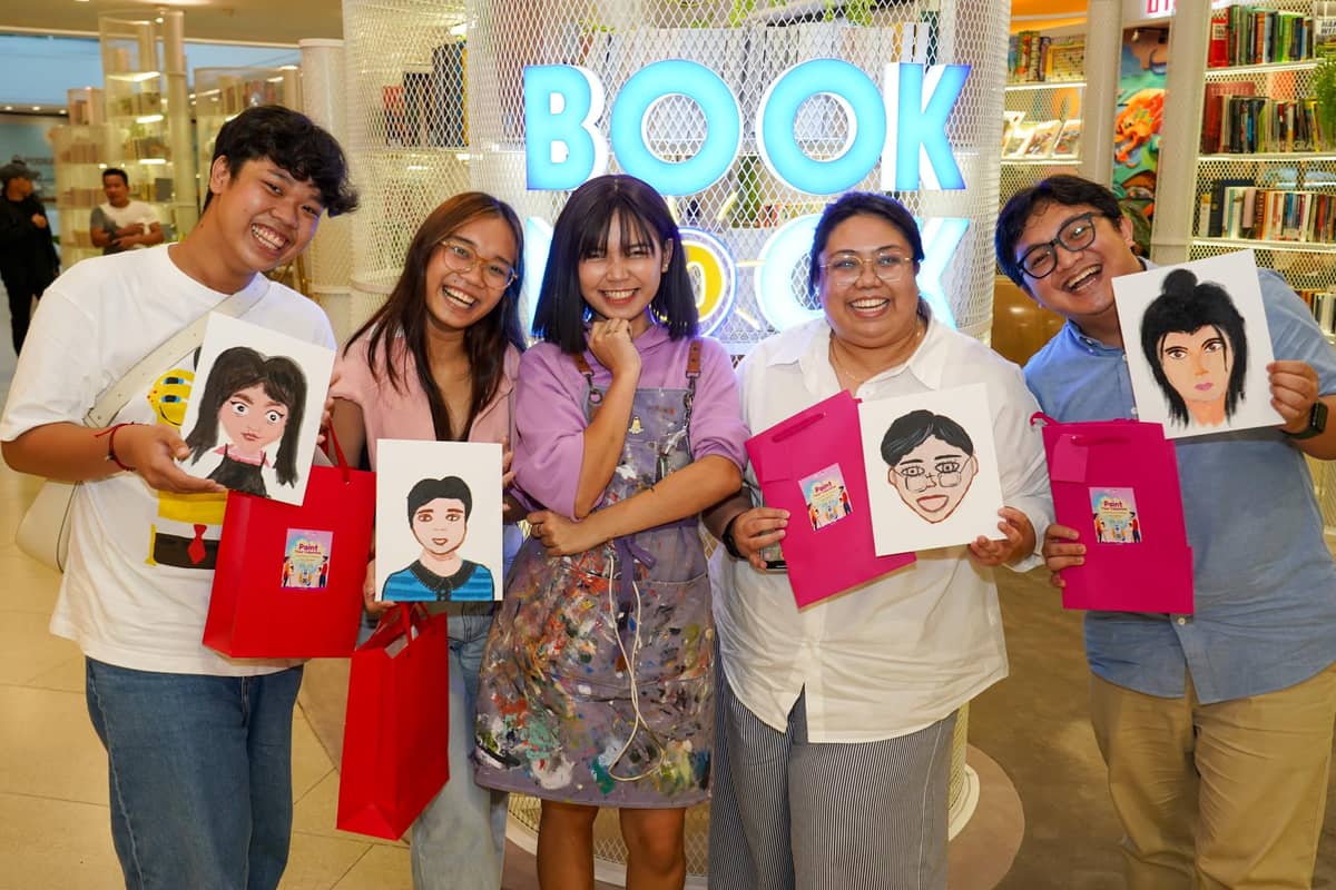 Young artists participate in a Paint Your Partner workshop, discovering new ways to tell stories through visual art.