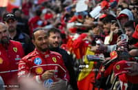 British F1 driver Lewis Hamilton signs autographs during the Scuderia Ferrari HP Drivers' presentation event by Unicredit, in Piazza Castello in Milan, on March 6, 2025.