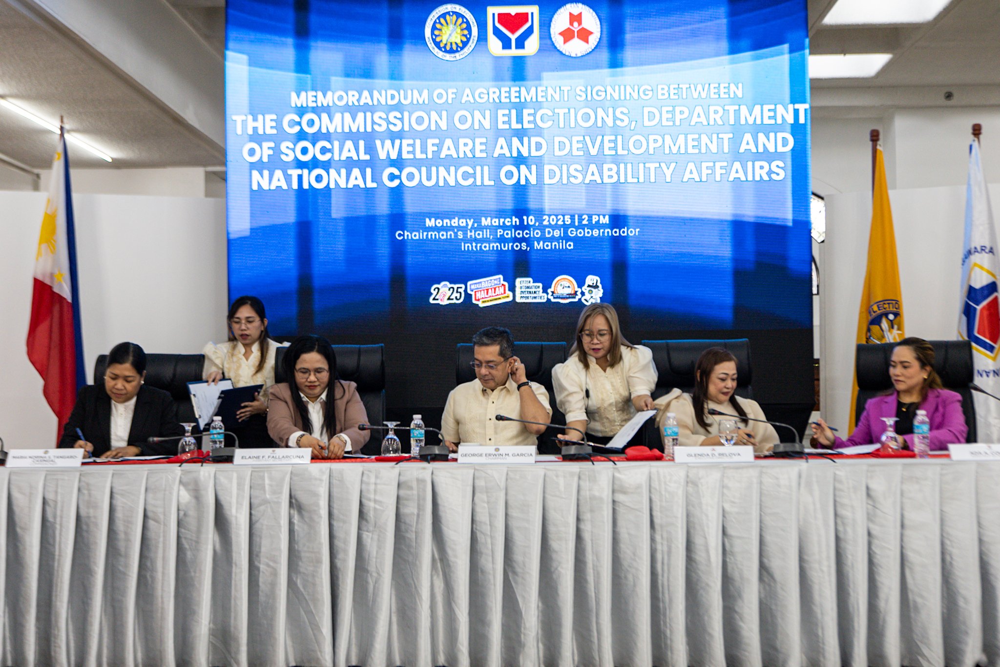 Commission on Elections (Comelec) Chairman George Garcia leads the signing of a memorandum of agreement with the Department of Social Welfare and Development and the National Council on Disability Affairs at the Comelec head office in Intramuros, Manila on Monday, 10 March 2025.

The agreement seeks to make the upcoming midterm elections more accessible to people with disabilities and ensure support for vulnerable sectors. A sign language translator was present to help deaf participants follow the event.