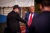 U.S. President Donald Trump and White House Senior Advisor, Tesla and SpaceX CEO Elon Musk shake hands after looking at Tesla vehicles on the South Lawn of the White House on March 11, 2025 in Washington, DC. Trump spoke out against calls for a boycott of Elon Musk's companies and said he would purchase a Tesla vehicle in what he calls a 'show of confidence and support' for Elon Musk.