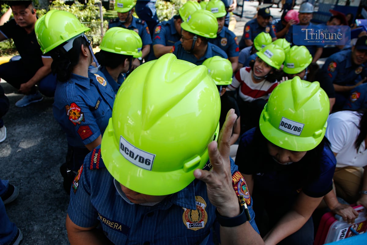 MANILA'S FINEST: Personnel from the Manila Police District participate in the first-quarter nationwide simultaneous earthquake drill at MPD grounds on UN Avenue, Manila, on 13 March 2025. The quarterly exercise aims to enhance preparedness among agencies and local government units while educating the public on earthquake safety measures.