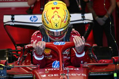 Hamilton in red, Verstappen defends