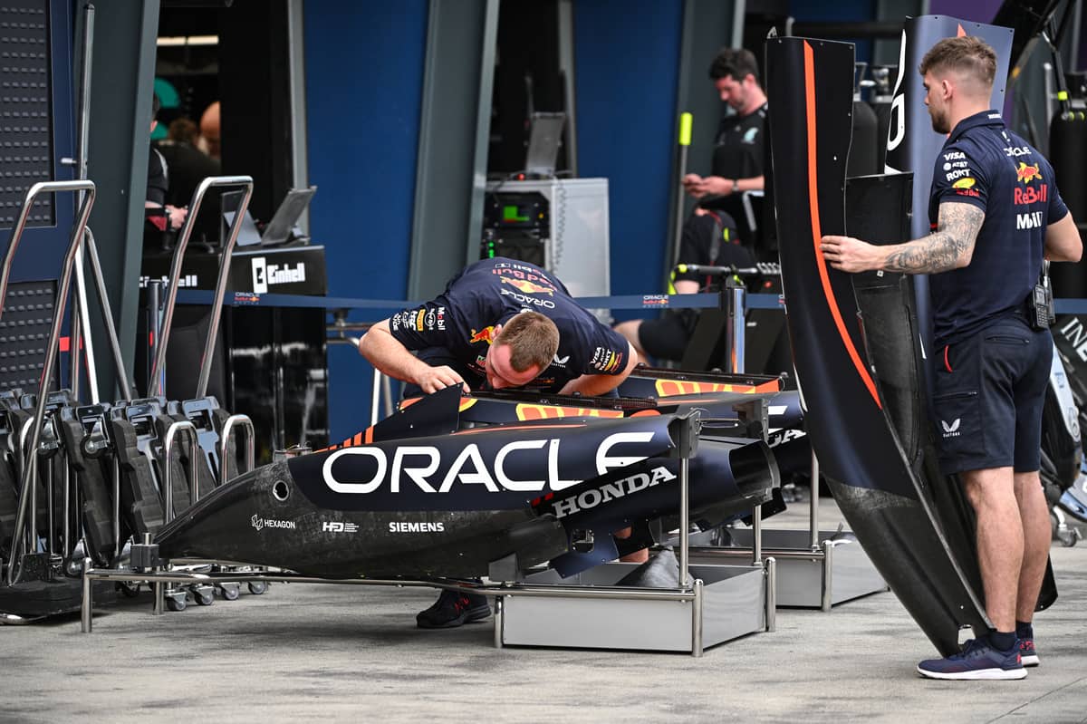 Red Bull mechanics work on their car to ensure Verstappen’s title defense starts with peak performance.