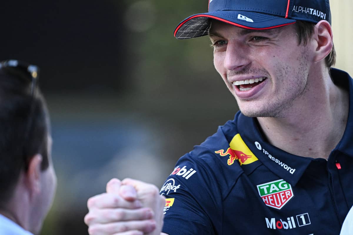 Max Verstappen greets the challenge with a smile as he gears up to defend his F1 title in a fiercely competitive season.