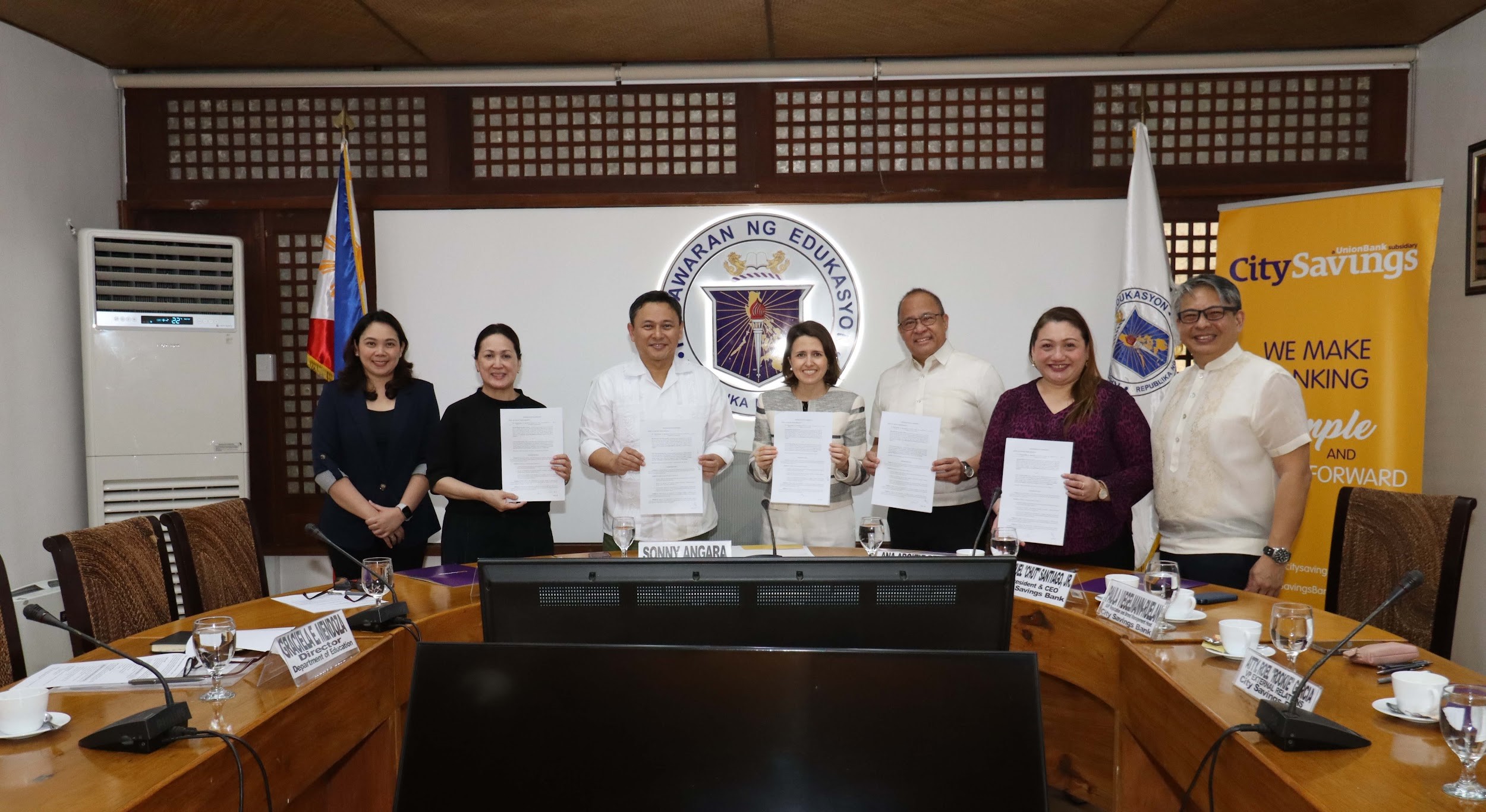 At the signing of the pivotal agreement are (from left) Department of Education external partnerships services director Ciela Mendoza, DepEd Assistant Secretary Cilette Liboro Co, DepEd Secretary Sonny Angara, CitySavings Bank chairperson Ana Aboitiz-Delgado, CitySavings president and CEO Manuel Santiago Jr., CitySavings AVP-reputation and brand management Paula Viegelmann-Ruelan and CitySavings SVP-External Relations head Roel Eric Garcia.