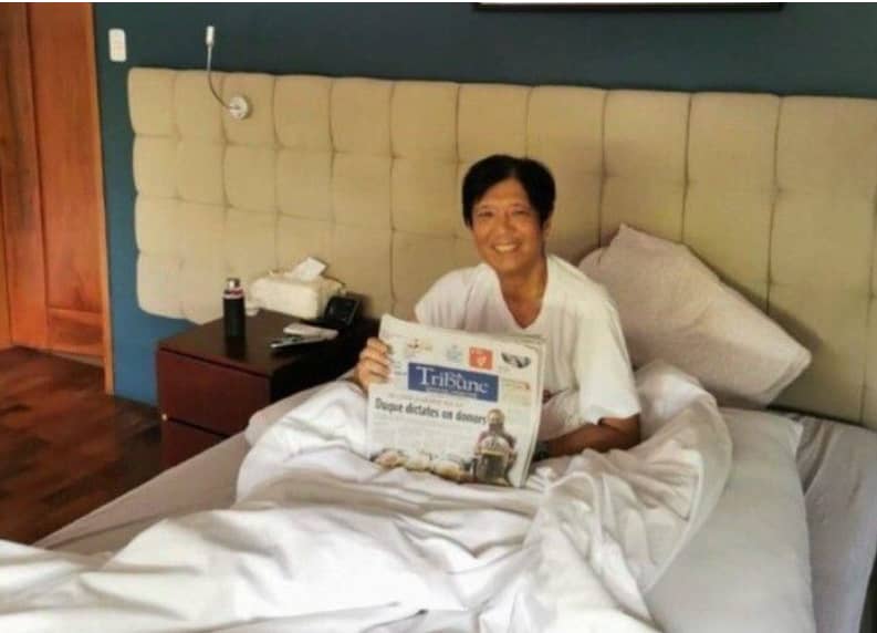 Bongbong Marcos holding a copy of DAILY TRIBUNE