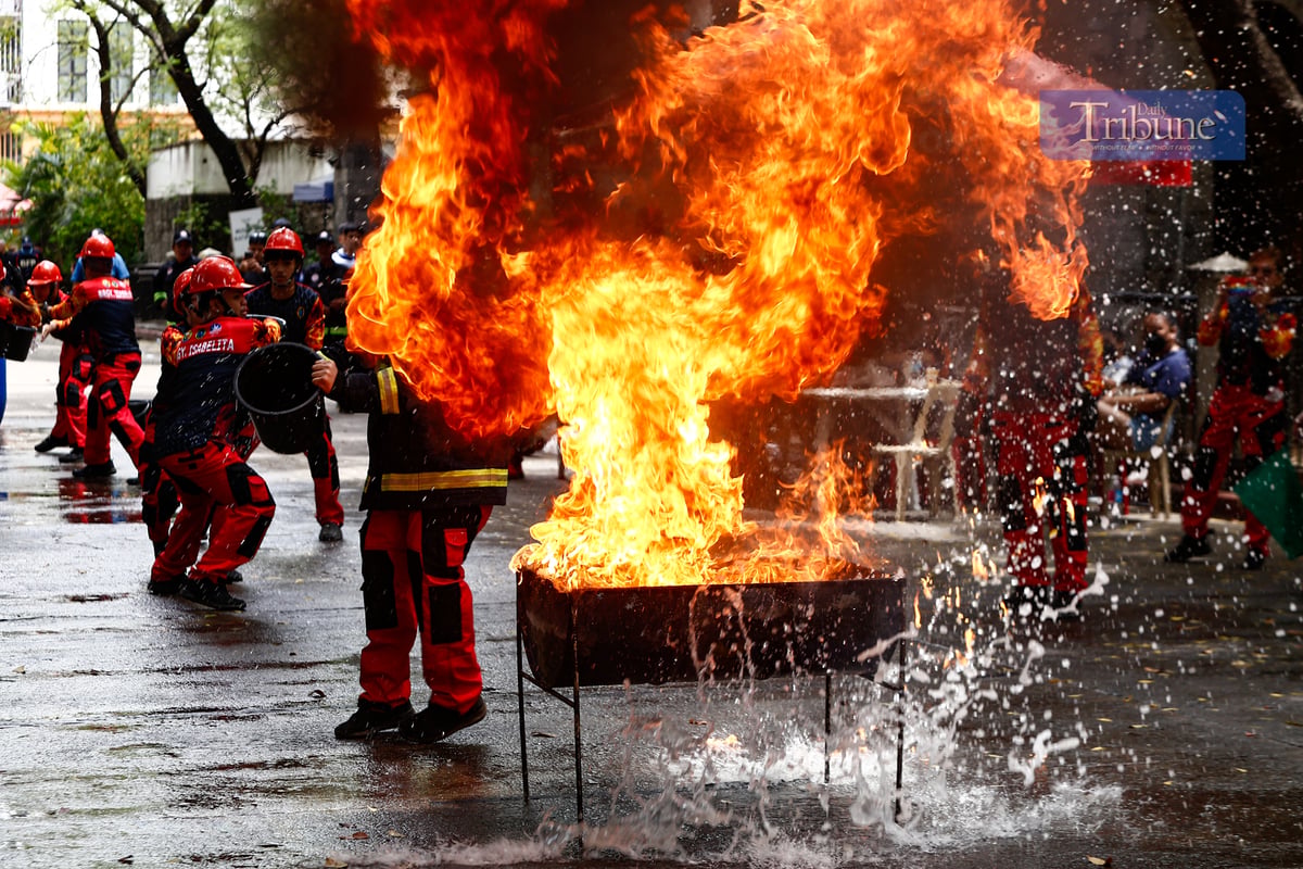 Fire volunteers from various barangays in San Juan City compete in obstacle courses simulating fire emergencies during the annual Fire Olympics on 17 March 2025.