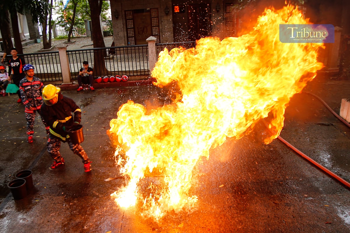 Fire volunteers from various barangays in San Juan City compete in obstacle courses simulating fire emergencies during the annual Fire Olympics on 17 March 2025.