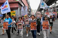 PROTESTERS carrying placards showing former president Rodrigo Duterte (L) and Senator Ronald dela Rosa (R) in a prison cell take part in a rally near Malacañang palace in Manila on 17 March 2025. The protesters are calling on the government to rejoin the International Criminal Court (ICC), days after former Philippine president Rodrigo Duterte was arrested and brought to the Hague to face charges of crimes against humanity over his deadly crackdown on drugs.