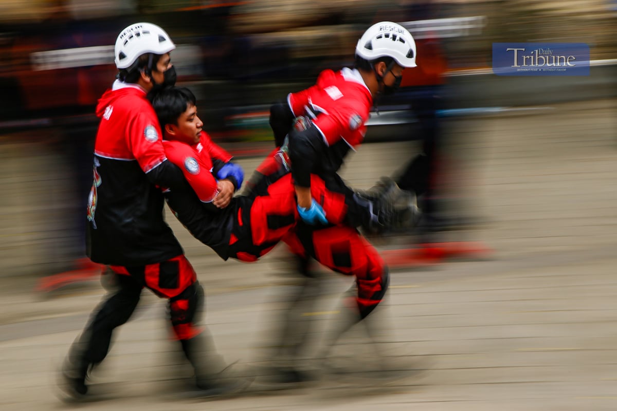 Fire volunteers from various barangays in San Juan City compete in obstacle courses simulating fire emergencies during the annual Fire Olympics on 17 March 2025.