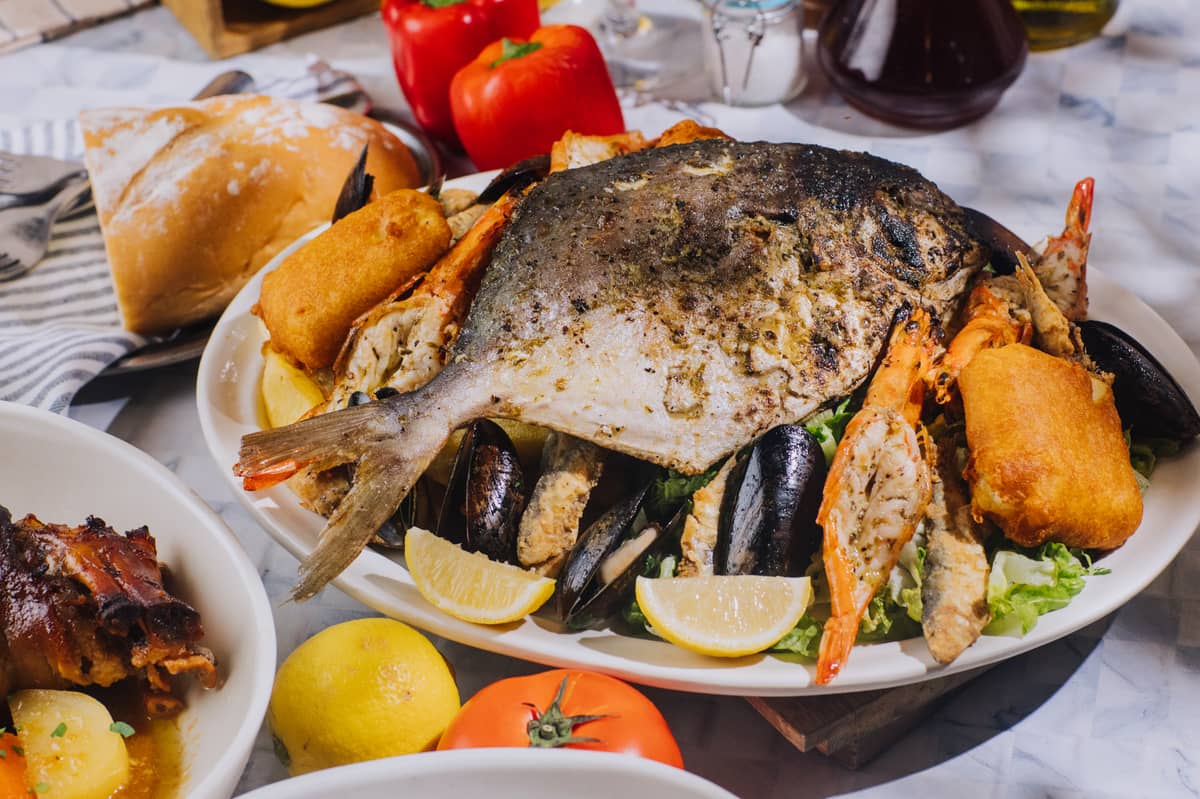Cretan Seafood Platter Chef’s favorite! Grilled pampano, fried halibut, crispy sardines, steamed mussels, grilled prawns, with crispy fries, shredded greens lemon.