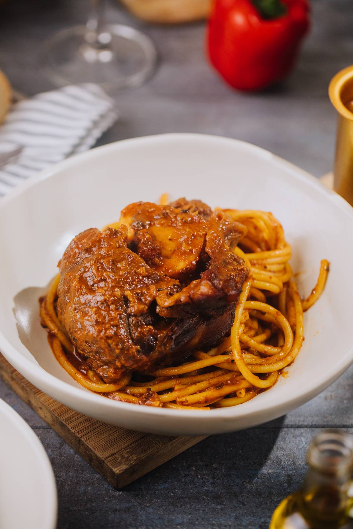 Greek Osso Bucco Pastisado braised beef shank, tomato sauce, bucatini, mizitra.
