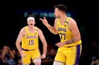 Luka Doncic sizzles with 31 points to power the Los Angeles Lakers to a 120-108 win over the Denver Nuggets in the NBA regular season.