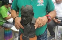 Ranque holds a paper mache bust of FPRRD during the 15 March prayer rally in Liwasang Bonifacio in Manila.