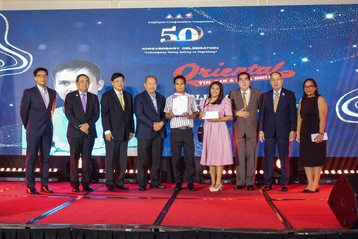 Joining the secretary during the ceremony are Labor Undersecretary Benjo Santos M. Benavidez (leftmost in the third row) and Labor Assistant Secretary Lennard Constantine C. Serrano (not in photo).