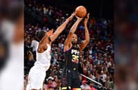 Kevin Durant fires 42 points and powers the Phoenix Suns to an upset 123-112 victory over the league-leading Cleveland Cavaliers in their NBA regular season game.