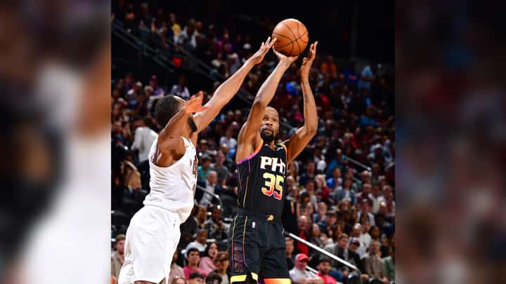 Kevin Durant fires 42 points and powers the Phoenix Suns to an upset 123-112 victory over the league-leading Cleveland Cavaliers in their NBA regular season game.