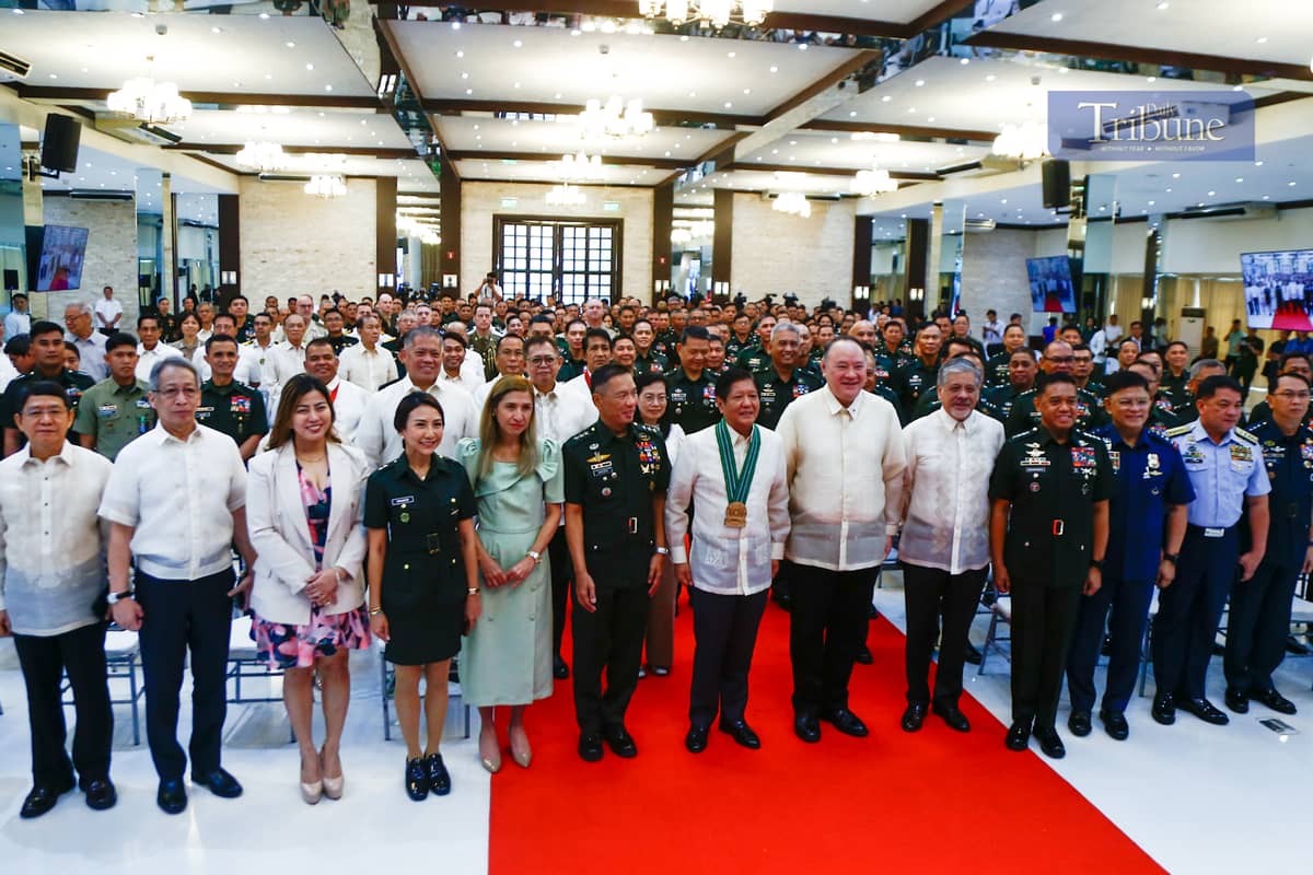 President Ferdinand R. Marcos Jr. (center) is enveloped by VIPs and guests of the 128th Founding Anniversary of the Philippine Army, including Defense Secretary Gilbert Teodoro and Special Assistant to the President Antonio Lagdameo Jr.
