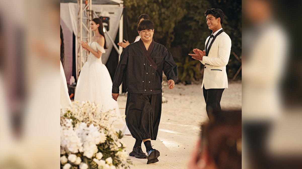 International Filipino fashion designer Bessie Besana and his ‘Ray of Twilight’ bridal assemblage.