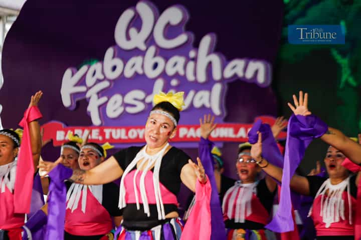 Women from various barangays in Quezon City compete in the Kababaihan Festival dance competition at the Quezon City Hall compound on 24 March 2025. Contestants also showcase costumes made from upcycled materials.