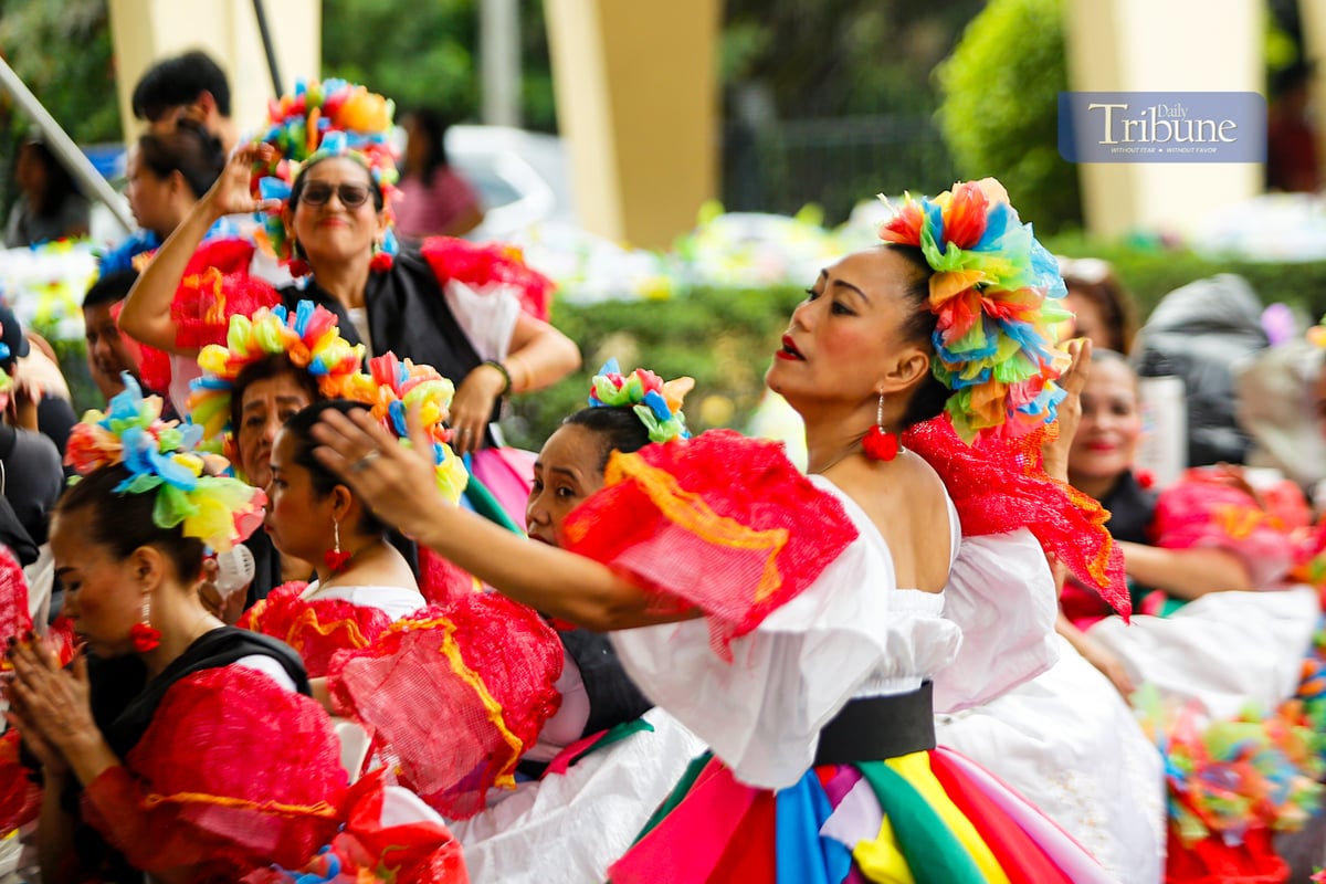 Women from various barangays in Quezon City compete in the Kababaihan Festival dance competition at the Quezon City Hall compound on 24 March 2025. Contestants also showcase costumes made from upcycled materials.