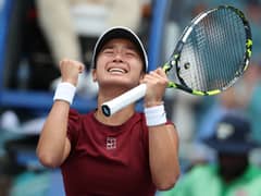 MIAMI GARDENS, FLORIDA - 26 MARCH: Alexandra Eala of the Philippines reacts at match point after defeating Iga Swiatek of Poland on Day 9 of the Miami Open at Hard Rock Stadium on 26 March 2025 in Miami Gardens, Florida.