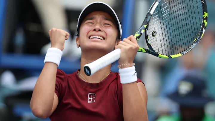 MIAMI GARDENS, FLORIDA - 26 MARCH: Alexandra Eala of the Philippines reacts at match point after defeating Iga Swiatek of Poland on Day 9 of the Miami Open at Hard Rock Stadium on 26 March 2025 in Miami Gardens, Florida.