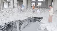 Yemenis inspect the damage in the Al-Rasul Al-Aadham cancer and oncology hospital’s unfinished building, a day after it was hit in a US strike in Yemen’s northern Saada province on 25 March 2025.