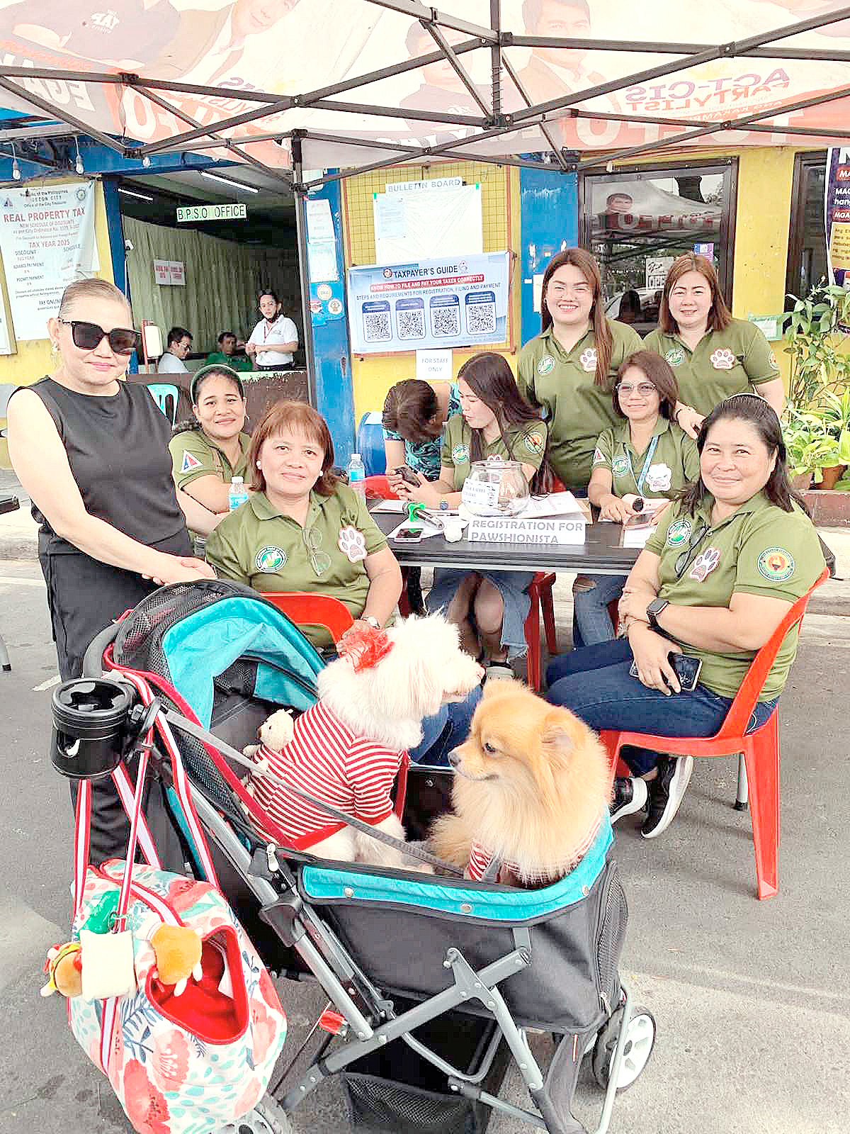 ANNA Rañeses (first from left), a pet care advocate and a psychologist by profession, is seen registering at the command post of ‘Pets-tival’ during the full-packed day of the affair.