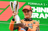 MCLAREN’s Australian driver Oscar Piastri celebrates on the podium with his trophy after winning the Formula One Chinese Grand Prix.