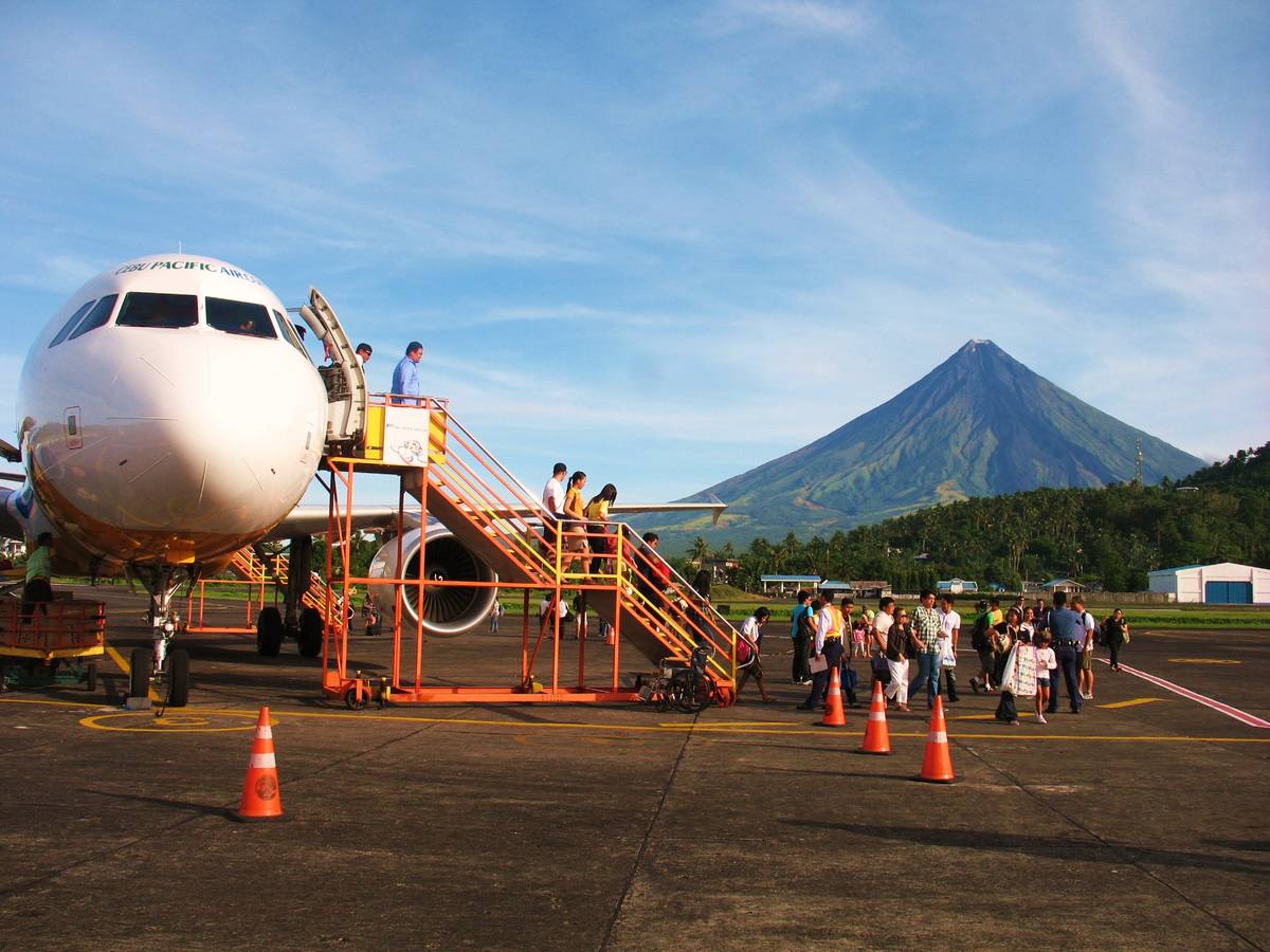 The volcano greets visitors disembarking a plane at the Bicol International Airport.