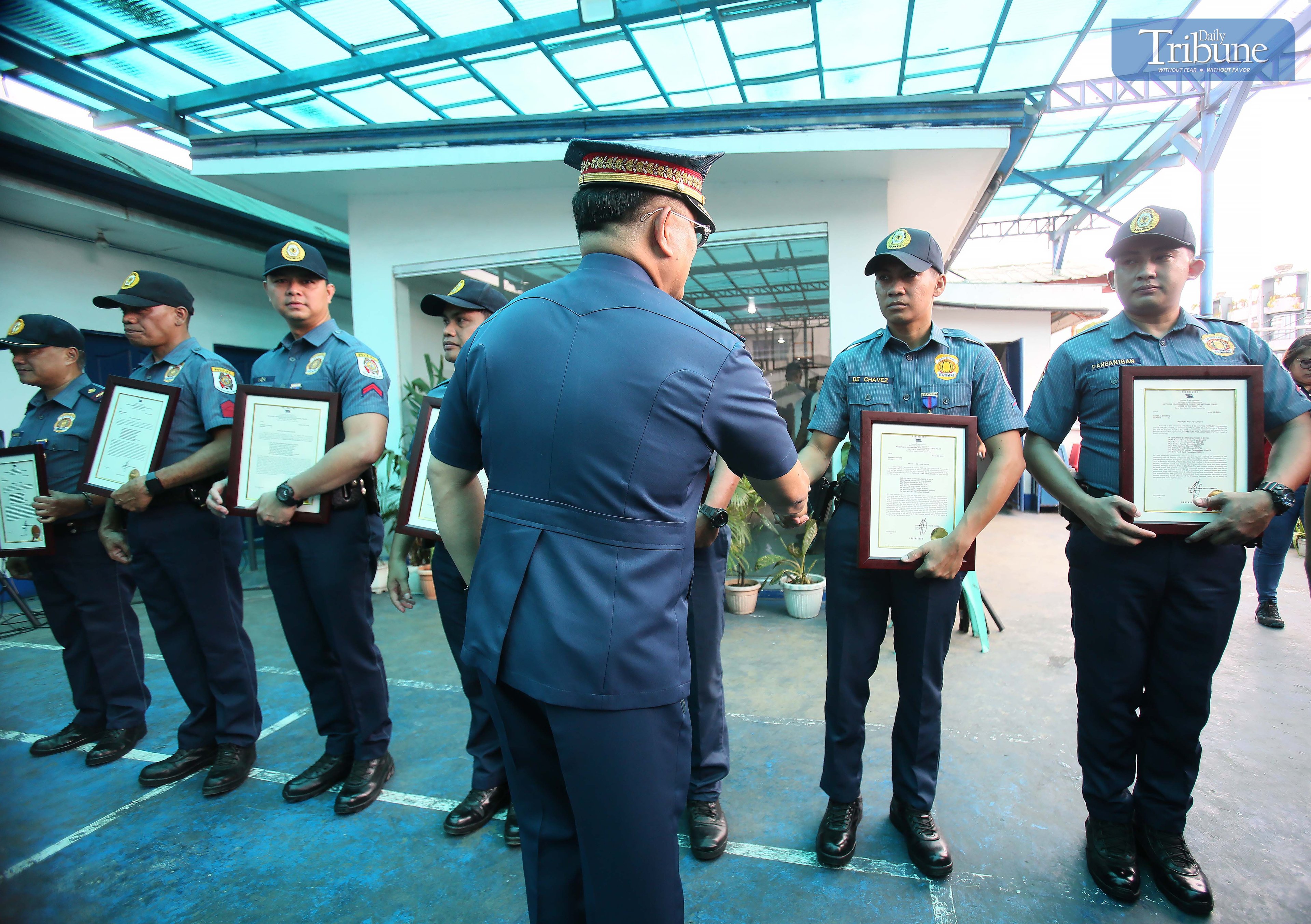 PNP Chief Rommel Marbil congratulates eight Antipolo police personnel during a medal awarding ceremony at the Antipolo Component City Police Station on Monday, 31 March 2025. The recognition was for their swift arrest of a suspect involved in a road rage incident along Marcos Highway in Sitio Calumpang, Barangay San Jose, Antipolo, on Sunday afternoon.