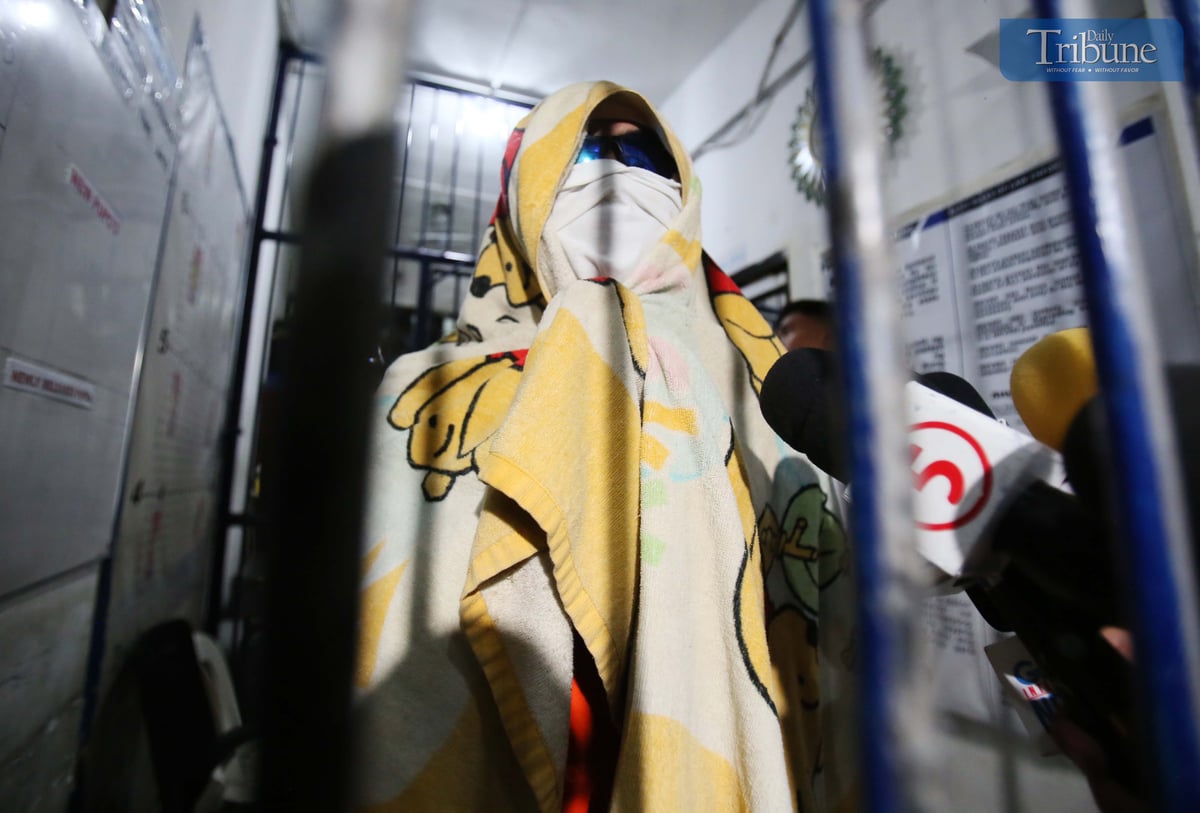 Kenneth Bautista, the suspect in a road rage incident in Antipolo City, speaks to the media during an interview at the Antipolo City Police Station on Monday, sharing his side of the shooting incident that left four people injured, including his partner.