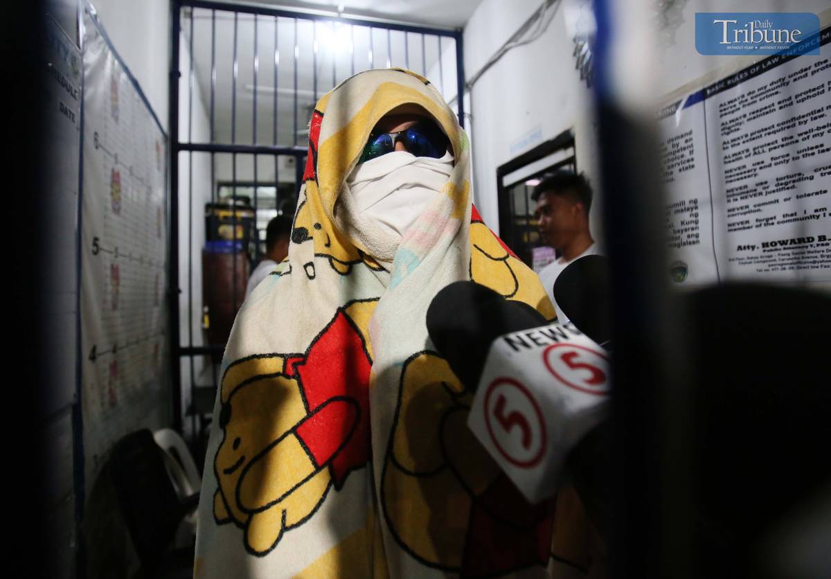 Kenneth Bautista, the suspect in a road rage incident in Antipolo City, speaks to the media during an interview at the Antipolo City Police Station on Monday, sharing his side of the shooting incident that left four people injured, including his partner.