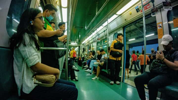 Passengers of the LRT-1 wait for the train to continue its journey after stopping at one of its stations in Manila on Wednesday. The LRT-1 management announced that it will be extending its weekday operations.