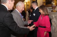 Britain's King Charles III greets BBC Journalist Riz Latif during a reception for media organisations across the country, at Buckingham Palace in central London, on 26 March 2025.