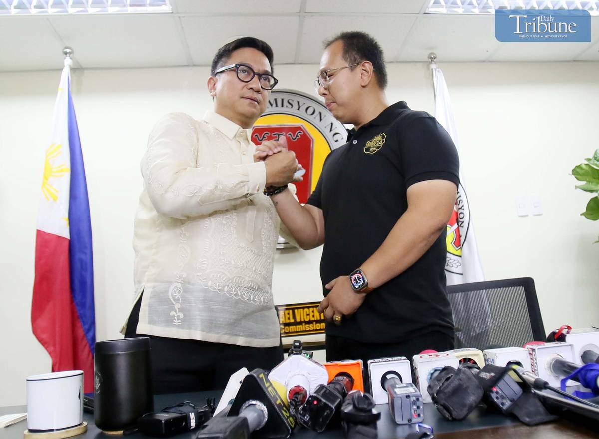 MMDA special operations head Gabriel Go apologizes for posting a video ticketing a cop for parking on the sidewalk during a press conference with NAPOLCOM Commissioner Rafael Vicente Calinisan, 3 April 2025, at the DILG-NAPOLCOM building in Quezon City.