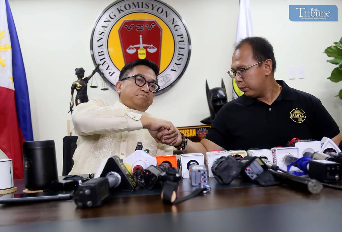 MMDA special operations head Gabriel Go apologizes for posting a video ticketing a cop for parking on the sidewalk during a press conference with NAPOLCOM Commissioner Rafael Vicente Calinisan, 3 April 2025, at the DILG-NAPOLCOM building in Quezon City.
