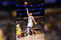 Stephen Curry dominates, firing 37 points to lift the Golden State Warriors to a 123-116 triumph over the Los Angeles Lakers in the NBA regular season.