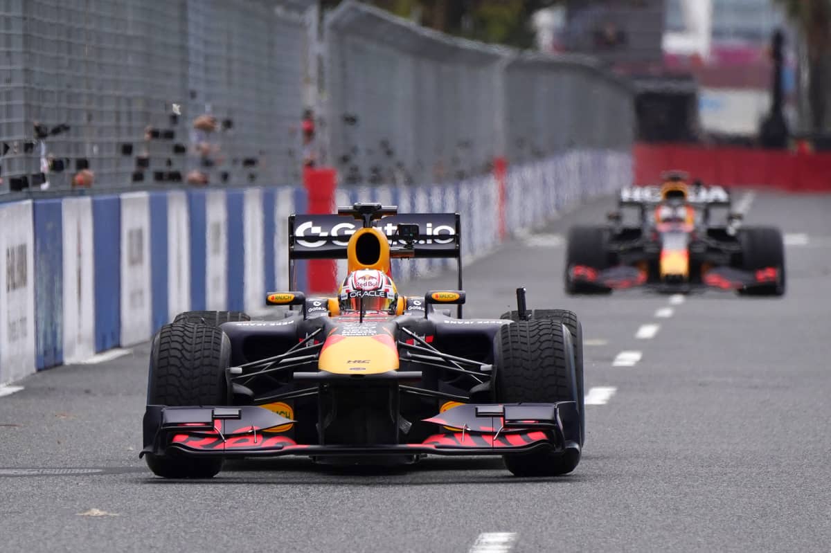 Red Bull Racing’s Japanese driver Yuki Tsunoda and Dutch driver Max Verstappen drive as part of the Red Bull Racing Show Run in Tokyo.